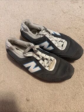 Women’s New Balance Black Sneakers with White and Light Blue Accents